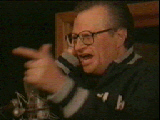 An action shot of Larry King from the Save the Rainforest music video